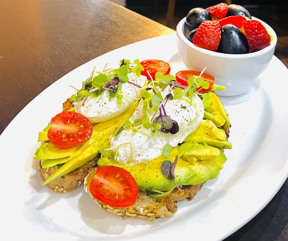 Avocado toast egg sandwich with fruit
